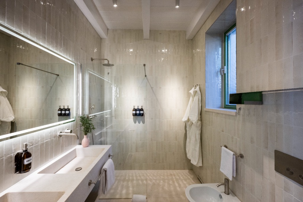 Newly uploaded ultra-luxury guest bathroom with double vanity and sea-facing views