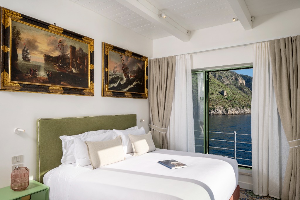 Second guest master bedroom suite with custom canopy frames and ocean-facing views